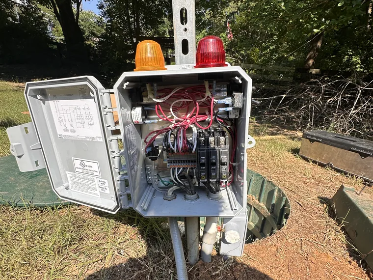 Septic pump and high-water alarm strobes wired at the tank in Metro Atlanta, GA