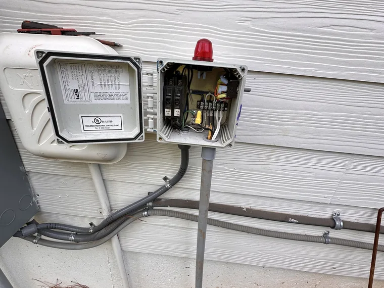 Septic pump control and alarm panel opened for service by SepticRooter™ in Metro Atlanta, Georgia