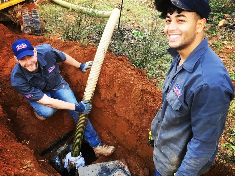 SepticRooter crew working in a trench on a Bowdon septic job