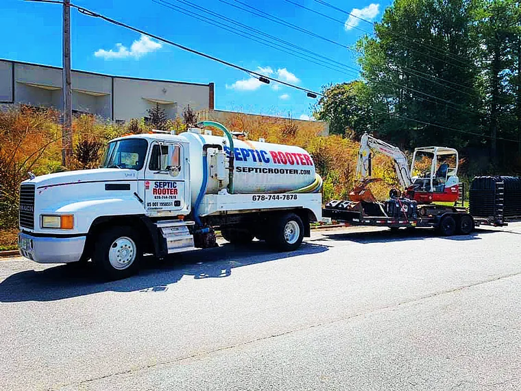 SepticRooter pump truck on the road heading to a service call